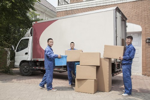 Removal van and moving boxes prepared for a West Green home move