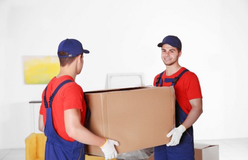 Removal van and moving boxes for a house move in West Green