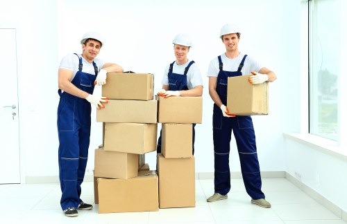 Furniture being carried from a local West Green property