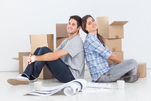 Careful furniture handling during a house move in West Green