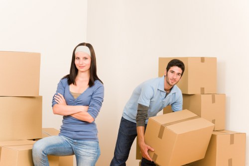 Professional movers loading a van for a West Green home move