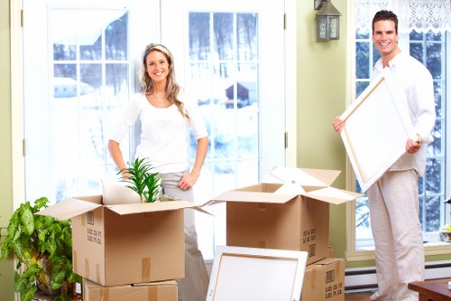 Careful wrapping and labelling of household items for relocation