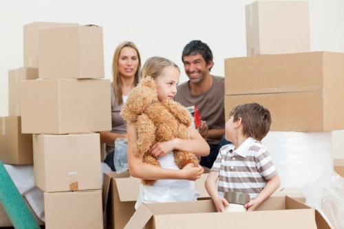 Prepared boxes and furniture ready for a West Green moving van